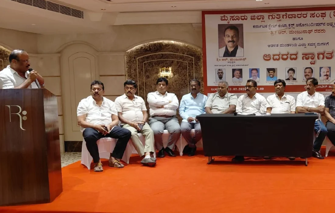 Manjunath Rudraiah participating in a Karnataka State Contractors Association (KSCA) leadership meeting in Mysuru with office bearers and association members discussing contractor welfare and infrastructure development.